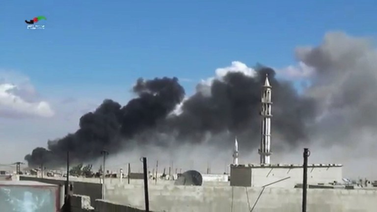In this image made from video provided by Homs Media Centre, which has been verified and is consistent with other AP reporting, smoke rises after airstrikes by military jets in Talbiseh of the Homs province, western Syria, Wednesday, Sept. 30, 2015. (Homs Media Centre via AP)