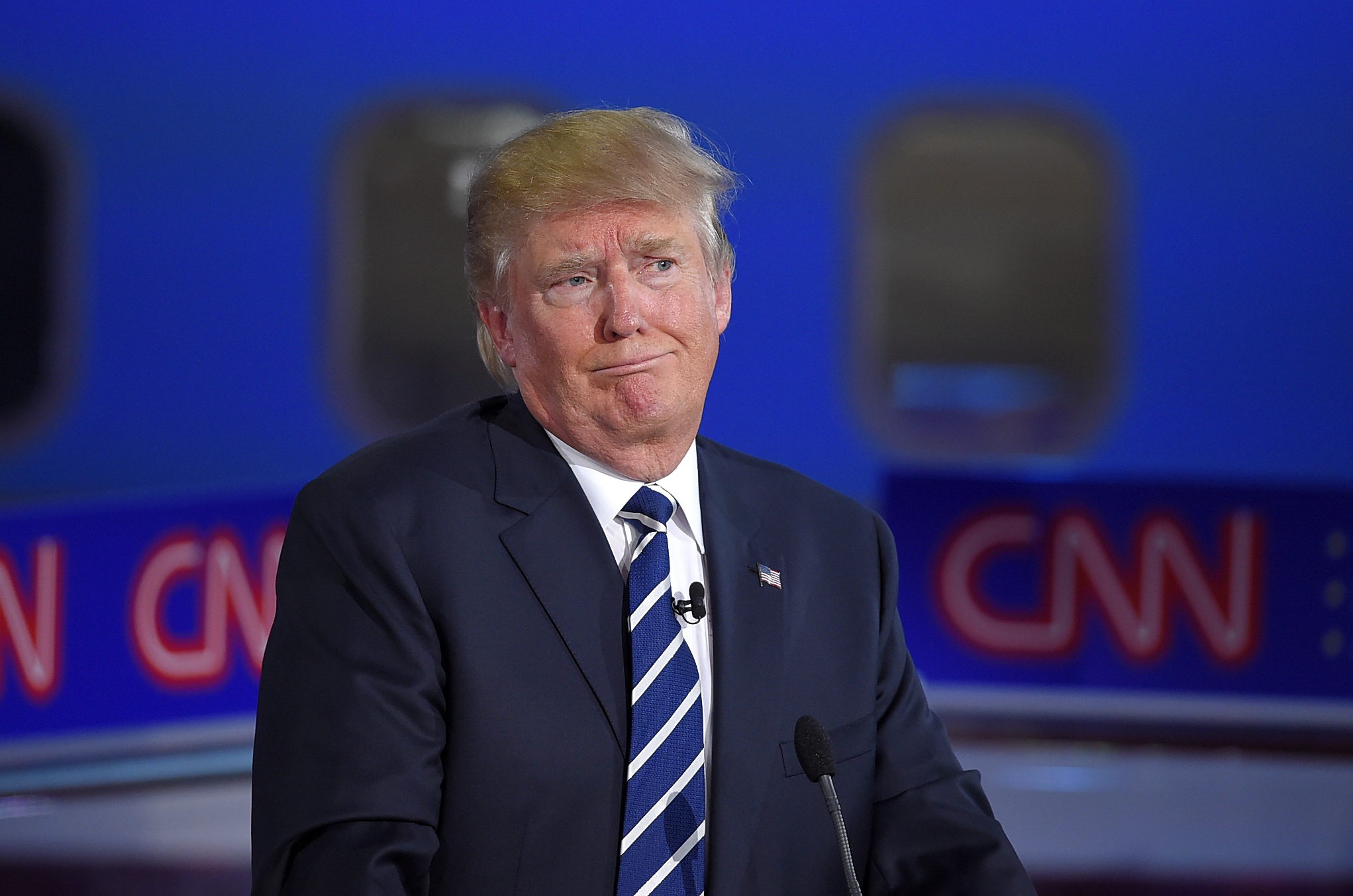 Trump backs off threat to skip CNN debate