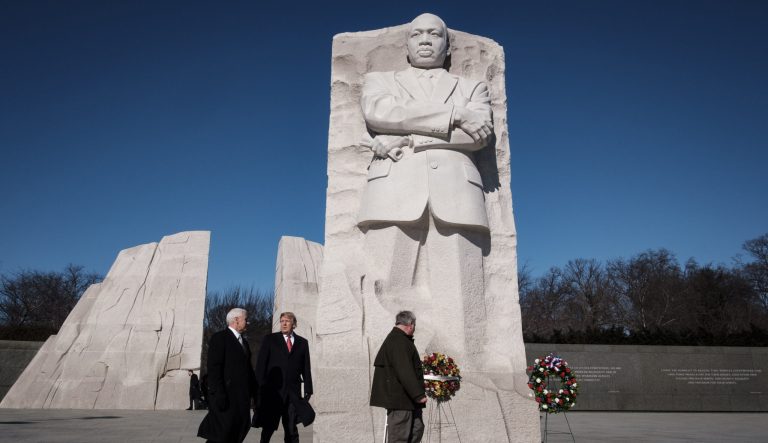 President Donald Trump, center, and Vice President Mike Pence, left, visit the Martin Luther King Jr. Memorial in Washington, D.C., on Monday, Jan. 21, 2019. 