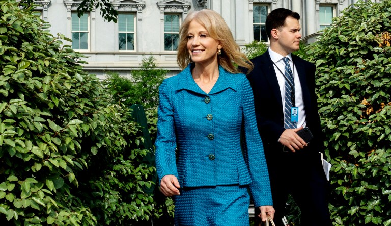 Kellyanne Conway, senior adviser to President Trump, arrives to speak to members of the media outside the White House in Washington, D.C., on Tuesday, accompanied by Tom Joannou, special assistant to the senior counselor.