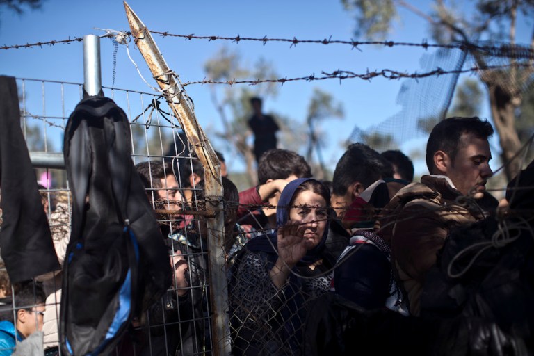 FILE - In this Nov. 4, 2015, file photo, people wait in line to enter the migrant and refugee registration camp in Moria, on the island of Lesbos, Greece. Some Republicans are pushing back against aggressive opposition in their party to Syrian refugees resettling in the U.S., fresh evidence of a rift within the GOP that threatens to complicate the partyâs outreach to minorities heading into the 2016 presidential contest. (AP Photo/Marko Drobnjakovic, File)