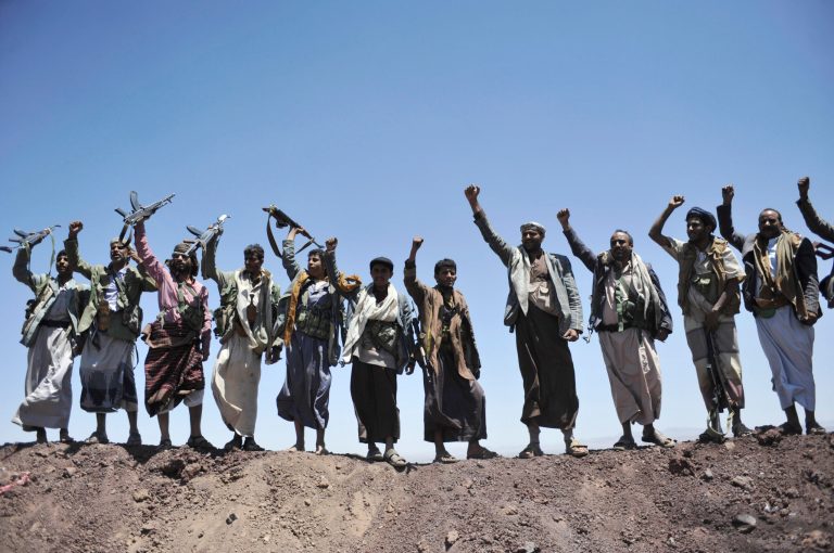 Hawthi Shiite rebels chant slogans at the compound of the army's First Armored Division, after they took it over, in Sanaa, Yemen, Monday, Sept. 22, 2014. Heavily armed Yemeni Shiite militiamen took over the headquarters and house of a powerful army general allied to Sunni Islamists on Monday and set up checkpoints across the capital, Sanaa, after sweeping across the city as the general and his allies fled and went into hiding. (AP Photo/Hani Mohammed)
