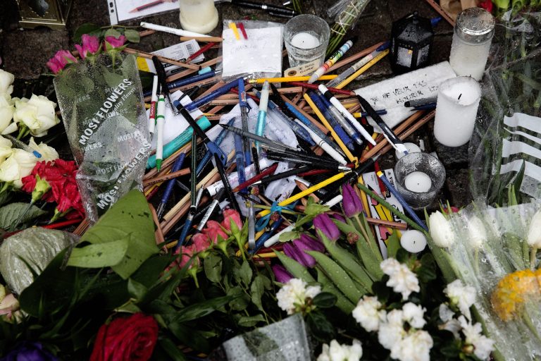 Coloured pencils and flowers are placed near the French Embassy in Copenhagen, Denmark, Saturday Jan. 10, 2015 to commemorate the victims of the shooting at the satirical newspaper Charlie Hebdo. (AP Photo/POLFOTO, Peter Hove Olesen)