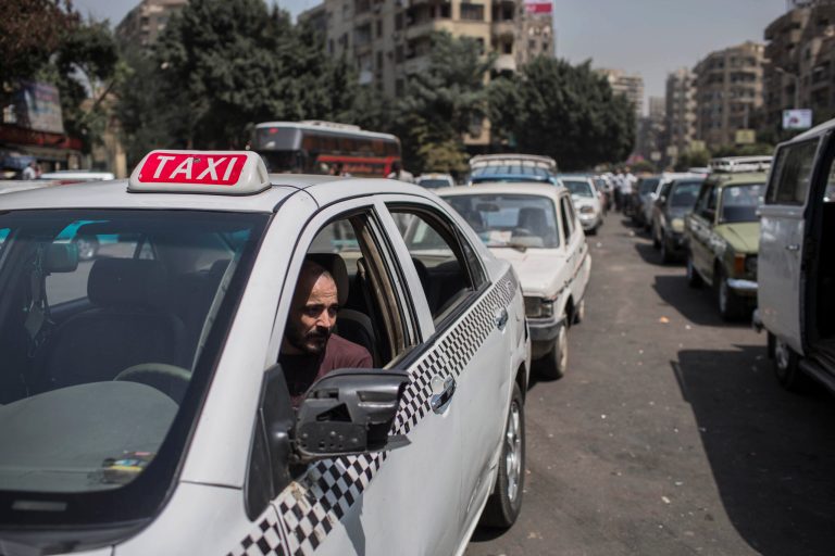 A taxi driver waits in line for fuel at a gas station, one of the businesses affected by a power outage in Giza, Cairo's neighboring city, Egypt, Thursday, Sept. 4 2014. Egypt suffered a massive power outage that halted parts of the Cairo subway, took TV stations off the air and ground much of the country to a halt for several hours Thursday, as officials offered no clear explanation for how the country suddenly lost 50 percent of its power generation. (AP Photo/Eman Helal)