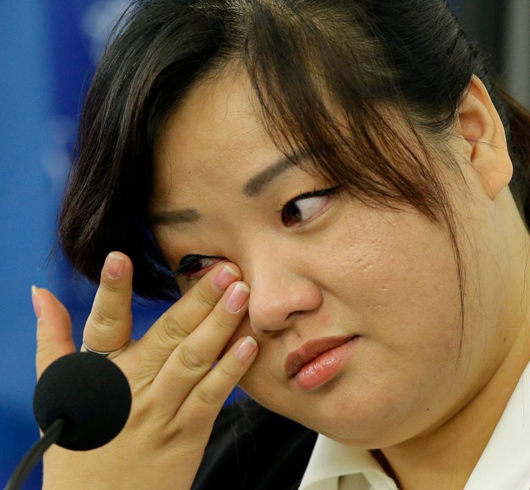 FILE - This Oct. 30, 2013 file photo shows Jin hye Jo wiping a tear as she testifies during a hearing of the United Nations mandated Commission of Inquiry about the human rights situation in the Democratic People's Republic of Korea, in Washington. Her father was tortured in detention in North Korea and died. Her elder sister went searching for food during the great famine of the 1990s, only to be trafficked to China. Her two younger brothers died of starvation, one of them a baby without milk whose life ebbed away in her arms. Jin Hye Jo tearfully told her family's story Wednesday to U.N. investigators during a public hearing in Washington, their latest stop in a globe-trotting effort to probe possible crimes against humanity in North Korea. (AP Photo/Alex Brandon, File)
