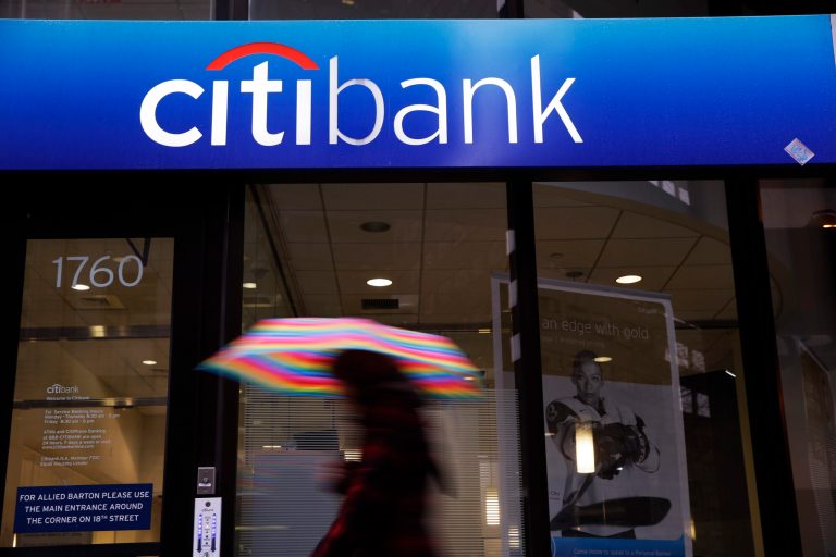 In this Jan. 14, 2014, file photo, a person walks past a Citibank location in Philadelphia. 