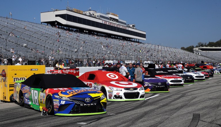 Race cars are lined up prior to the NASCAR Cup Series 300 auto race at New Hampshire Motor Speedway in Loudon, N.H., Sunday, Sept. 24, 2017. (AP Photo/Charles Krupa)