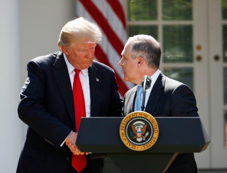 President Donald Trump shakes hands with EPA Administrator Scott Pruitt after speaking about the US role in the Paris climate change accord, Thursday, June 1, 2017, in the Rose Garden of the White House in Washington. (AP Photo/Pablo Martinez Monsivais)