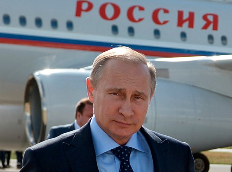 Russian President Vladimir Putin walks past his plane upon his arrival at the airport of Samara, Russia, Monday, July 21, 2014. (AP Photo/RIA-Novosti, Alexei Nikolsky, Presidential Press Service)