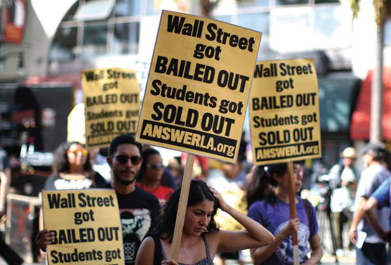 Students protest the rising costs of student loans for higher education on Hollywood Boulevard in the Hollywood section of Los Angeles, California. (Photo by David McNew/Getty Images)