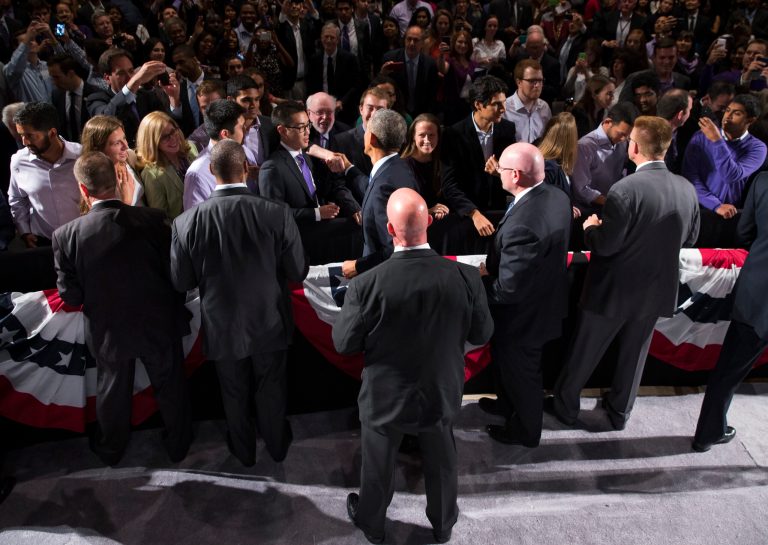 Secret Service agents surround President Barack Obama as he greets guests after speaking about the economy, Thursday, Oct. 2, 2014, at Northwestern University in Evanston, Ill. Obama is looking to frame the closing economic arguments of the midterm campaign. (AP Photo/Evan Vucci)