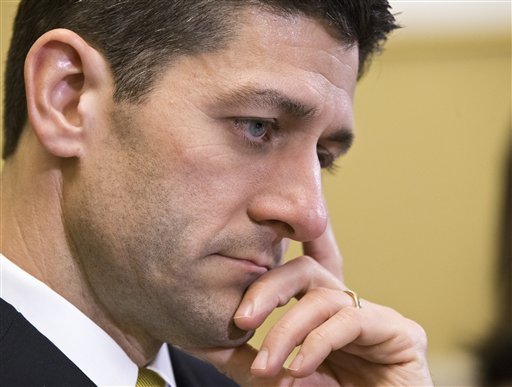 FILE - In this March 18, 2013 file photo, House Budget Committee Chairman Rep. Paul Ryan, R-Wis. is seen on Capitol Hill in Washington. The Senate pressed ahead Wednesday on a huge, bipartisan spending bill aimed at keeping the government running through September and ruling out the chance of a government shutdown later this month. The developments in the Senate come as the House resumed debate on the budget for next year and beyond. Republicans are pushing a plan that promises sharp cuts to federal health care programs and domestic agency operating budgets as the price for balancing the budget in a decade.  (AP Photo/J. Scott Applewhite, File)