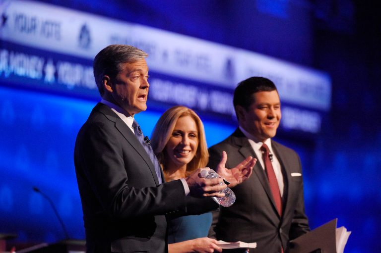 Debate moderators John Harwood, left, Becky Quick, center, and Carl Quintanilla take the stage during the CNBC Republican presidential debate at the University of Colorado, Wednesday, Oct. 28, 2015, in Boulder, Colo. Fox News' Sean Hannity declared that the big loser at the debateÂ was CNBC.Â (AP Photo/Mark J. Terrill)
