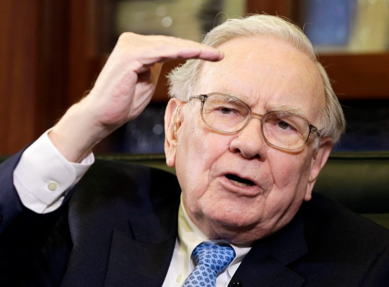 FILE - In this May 5, 2014 file photo, Berkshire Hathaway Chairman and CEO Warren Buffett gestures during an interview with Liz Claman on the Fox Business Network in Omaha, Neb. The stock price of Berkshire Hathaway topped $200,000 for the first time Thursday morning, Aug. 14, 2014. Class A shares of Berkshire jumped past the milestone to an all-time trading high of $201,625. (AP Photo/Nati Harnik, File)