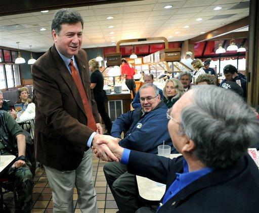 George Allen shakes hands with Major John R. Williams, USMC (Ret) as he speaks at a breakfast in Bristol, Va. Friday, March 25, 2011. Allen was touring Southwest Virginia to kickoff his campaign for the United States Senate. (AP Photo/Bristol Herald Courier, David Crigger)