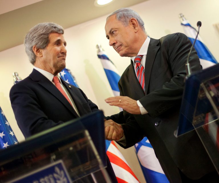 U.S. Secretary of State John Kerry, left, and Israeli Prime Minister Benjamin Netanyahu shakes hands during their joint statement at the prime minister's office in Jerusalem, Thursday, Dec. 5, 2013. Kerry is visiting Jerusalem and Ramallah to have the Israeli-Palestinian peace talk and to consult Israeli officials about Iran. (AP Photo/Pablo Martinez Monsivais, Pool)