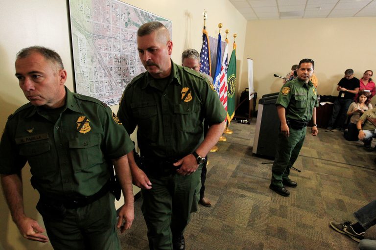 U.S. Border Patrol Tucson Sector officers leave after a news conference in Bisbee, Ariz.(AP Photo/Ross D. Franklin)
