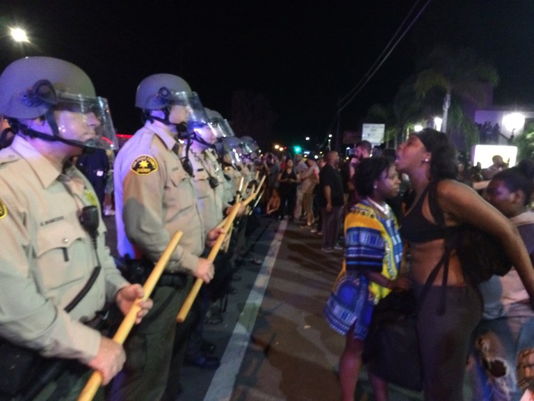 A new report from the Department of Justice found that a lack of diversity in police departments is hurting community policing. (AP Photo/Julie Watson)