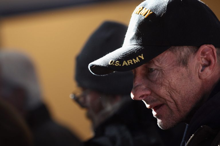 DENVER, CO - NOVEMBER 03:  A homeless U.S. military veteran stands in line for free winter clothing at a 