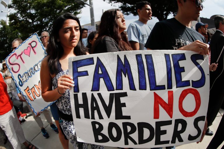 Protestors rally in support of the Deferred Action for Childhood Arrivals program known as DACA outside the offices of Sen. Rob Portman, R-Ohio, Tuesday, Sept. 5, 2017, in Cincinnati. (AP Photo/John Minchillo)