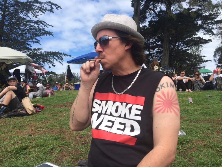 Shane Kinoshita from San Francisco smokes marijuana in Golden Gate Park in the area unofficially known as 