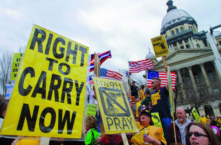 FILE - In this March 7, 2012 file photo, gun owners and supporters participate in an Illinois Gun Owners Lobby Day rally at the Illinois State Capitol in Springfield. The next big issue in the national debate over guns _ whether people have a right to be armed in public _ is moving closer to Supreme Court review. A provocative ruling by a panel of federal appeals court judges in Chicago struck down the only statewide ban on carrying concealed weapons, in Illinois. The ruling is somewhat at odds with those of other federal courts that have largely upheld state and local gun laws, including restrictions on concealed weapons, since the Supreme Court's landmark ruling declaring that people have a right to have a gun for self-defense. (AP Photo/Seth Perlman, File)