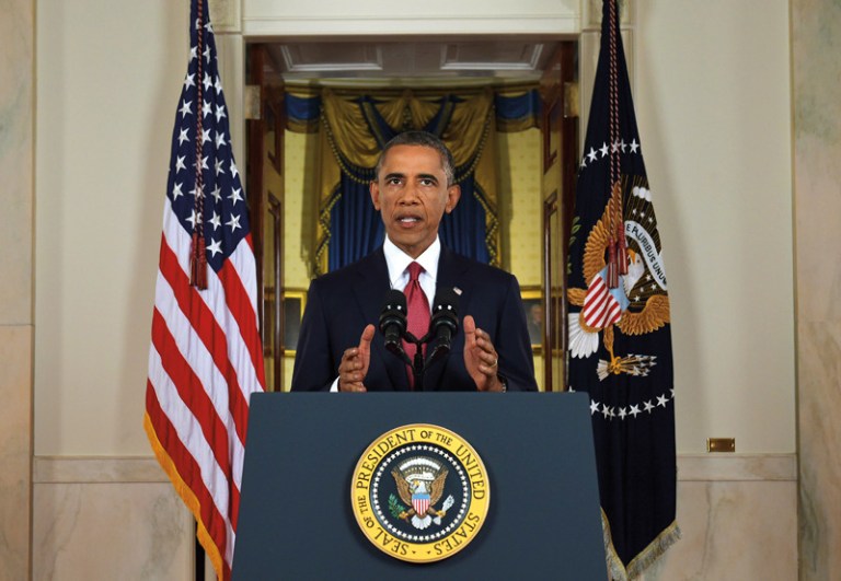 President Barack Obama addresses the nation from the Cross Hall in the White House in Washington, Wednesday. (AP Photo/Saul Loeb)