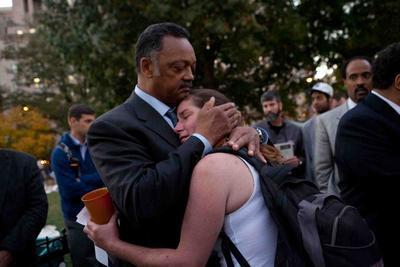 Reverend Jesse Jackson embraces an 