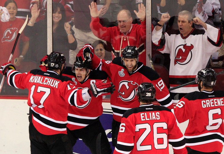   New Jersey Devils' Zach Parise, second from left, celebrates with teammates after scoring a goal in the first period during Game 5 of the NHL hockey Stanley Cup finals against the Los Angeles Kings Saturday, June 9, 2012, in Newark, N.J.. (AP Photo/Frank Franklin II)  