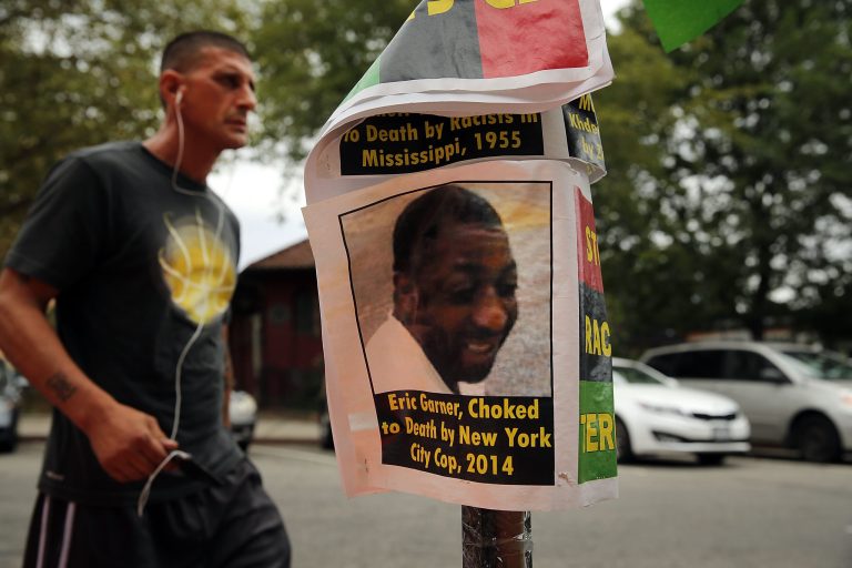 A flyer with a picture of Eric Garner is seen near where he was killed in an encounter with an NYPD officer in July on August 22, 2014 in the borough of Staten Island in New York City. Eric Garner, 43, died while he was being arrested for allegedly selling loose cigarettes in front of a bodega and was put into a chokehold during a confrontation with police. (Photo by Spencer Platt/Getty images)