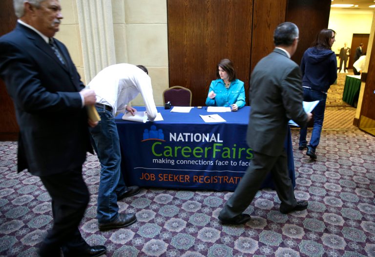 Job seekers arrive to meet prospective employers during a career fair at a hotel in Dallas. (AP/LM Otero)