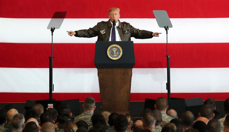 President Trump delivered a speech to the U.S. troops at the U.S. Yokota Air Base, on the outskirts of Tokyo, on Sunday. Trump arrived in Japan Sunday on a five-nation trip to Asia, his second extended foreign trip since taking office and his first to Asia. (AP Photo/Eugene Hoshiko)