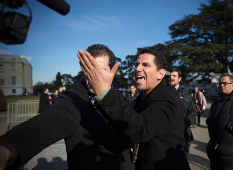 In this Tuesday, Jan. 28, 2014 picture, Syrian journalists argue with each other at the United Nations headquarters in Geneva, Switzerland. The bitterness and rancor stirred by Syria's civil war were on full display this week, both inside and outside the sealed room where rival delegations were seeking a way to end the conflict. In the hallways of the U.N.'s European headquarters and on the manicured lawns outside, tempers flared between supporters and opponents of President Bashar Assad.(AP Photo/Anja Niedringhaus)