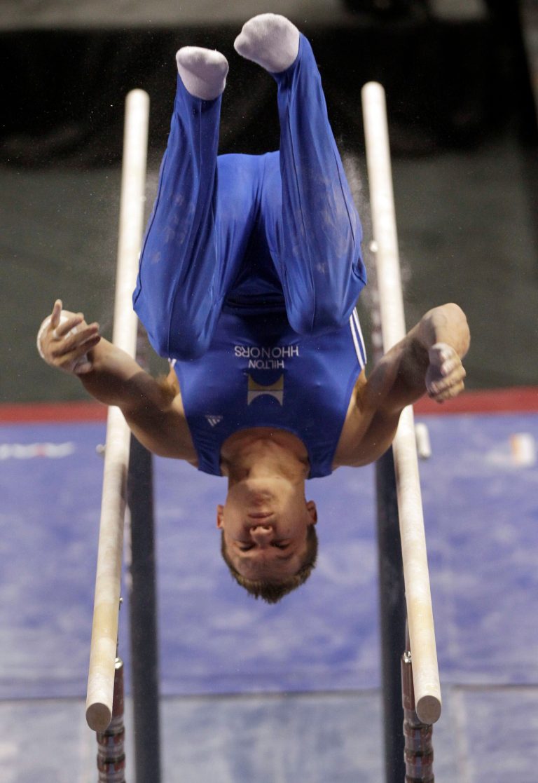   Jonathan Horton competes in the parallel bars during the men's senior division at the U.S. gymnastics championships on Thursday, June 7, 2012, in St. Louis. (AP Photo/Jeff Roberson)  