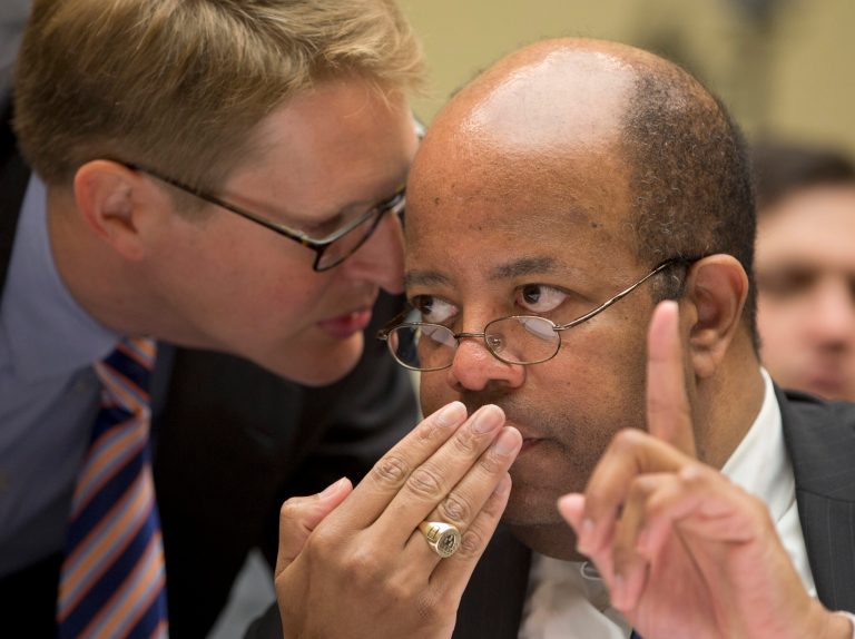 J. Russell George, the Treasury inspector general for tax administration, right, talks with a member of his staff as he testified before the House Oversight and Government Reform Committee hearing to investigate the extra scrutiny IRS gave to Tea Party and other conservative groups that applied for tax-exempt status.   (AP Photo/Carolyn Kaster)