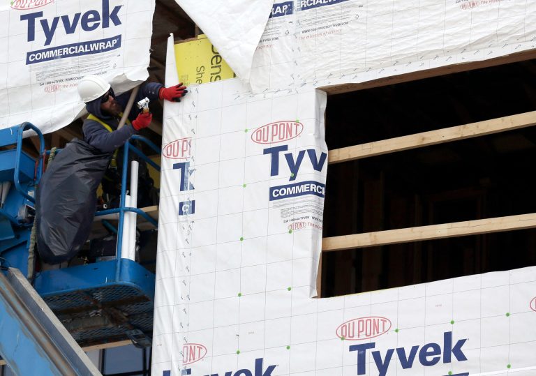 In this March 26, 2014 photo, a builder works on a home under construction in northwest Chicago. The Conference Board reports on its index of leading economic indicators for March on Monday, April 21, 2014. (AP Photo/Nam Y. Huh)