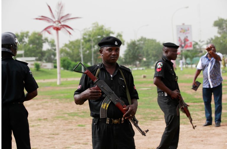 Police officers stand guard,  during a rally calling on the Government to rescue the school girls kidnapped from the Chibok Government secondary school in Abuja, Nigeria, Sunday May 11, 2014. The failure to rescue the kidnapped girl students who remain captive after some four weeks has attracted mounting national and international outrage, and one of the teenagers who escaped from the Islamic extremists who abducted the hundreds of schoolgirls, science student Sarah Lawan said Sunday in an interview with The Associated Press the kidnapping was 