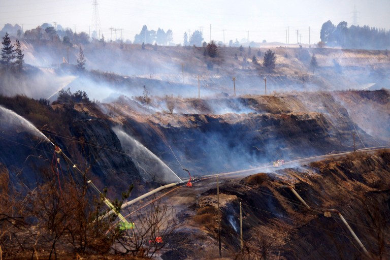 In this Feb. 25, 2014, photo provided by the Incident Control Centre, a fire burns at the Hazelwood Coal Mine at Morwell, Australia. Victoria state Chief Health Officer Rosemary Lester said Friday, Feb. 28, 2014, that vulnerable residents are advised to leave the town of Morwell as a precaution because the fire in the nearby mine is expected to spew smoke for at least 10 more days. (AP Photo/Incident Control Centre) EDITORIAL USE ONLY