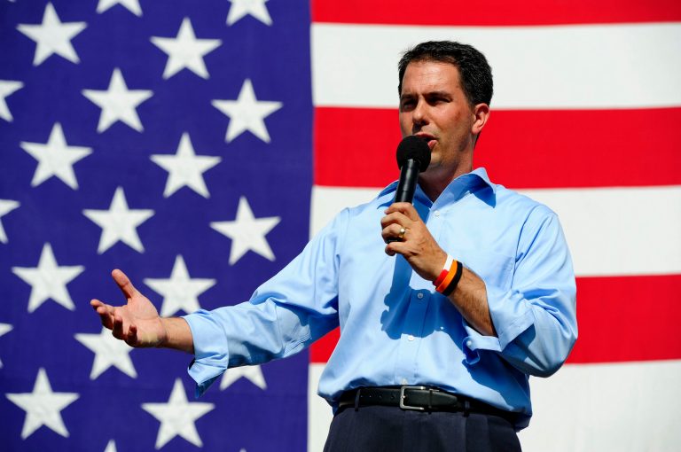 Republican Gov. Scott Walker is using his new book to renew his criticism of 2012 GOP presidential nominee Mitt Romney and raise his own national profile as a reformer who took on public sector unions and won. (AP Photo/ Richard Shiro)