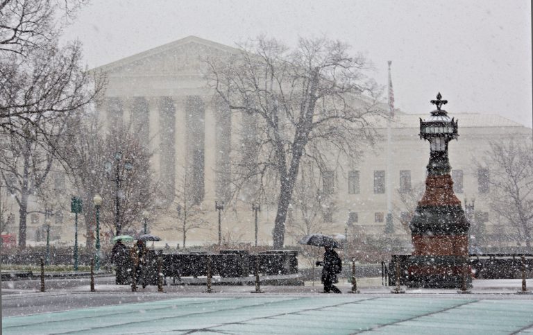 on Tuesday, a District of Columbia spokeswoman told the Washington Examiner that virtually all D.C. employees were at home due to the snow that dusted the capital region. (AP Photo)