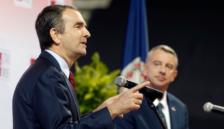 Northam didn't so much dump him under the bus as he jacked the vehicle up on stilts, dragged him under, and dropped it on him. (AP Photo/Steve Helber)