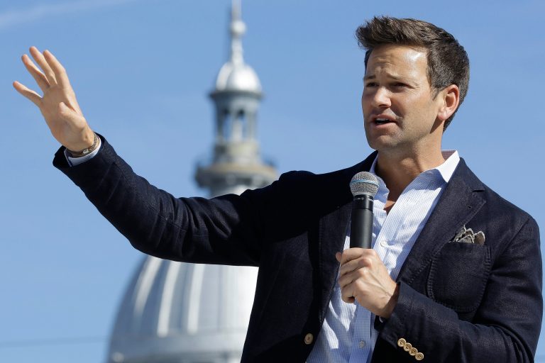U.S. Rep. Aaron Schock, R-Ill., speaks in support of Republican gubernatorial candidate Bruce Rauner during a campaign rally outside the State Capitol in Springfield, Ill., Monday, Nov. 3, 2014. (AP Photo/Seth Perlman)