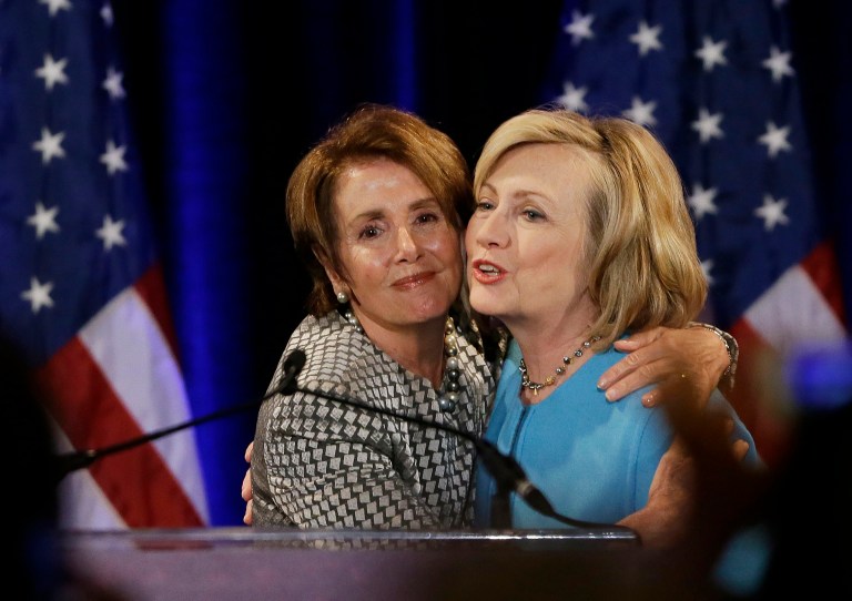 Former Secretary of State Hillary Rodham Clinton, right, is embraced by House Minority Leader Nancy Pelosi, left, before speaking at a fundraiser for Democratic congressional candidates hosted by Pelosi at the Fairmont Hotel, Monday, Oct. 20, 2014, in San Francisco. (AP Photo/Eric Risberg)