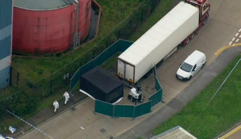 An aerial view as police forensic officers attend the scene after a truck was found to contain a large number of dead bodies, in Thurock, South England, Wednesday Oct. 23, 2019. Police in southeastern England said that 39 people were found dead Wednesday inside a container truck believed to have come from Bulgaria. 