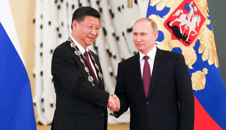 Russian President Vladimir Putin met Chinese President Xi Jinping in Moscow on Tuesday. Russia and China agreed Tuesday that North Korea should halt missile tests and the United States should not deploy a missile shield or conduct large-scale military exercises with South Korea. (Sergei Ilnitsky/Pool photo via AP)