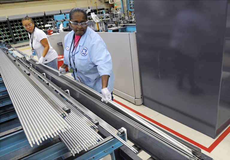 In this July 30, 2014 photo, quality control inspector Tina Person, left, and scanner pperator Dewanna Murphy inspect tubes that are used in the production of the fuel bundle assembly at the GE Hitachi plant in Castle Hayne, N.C. (AP Photo/The Star-News, Mike Spencer)
