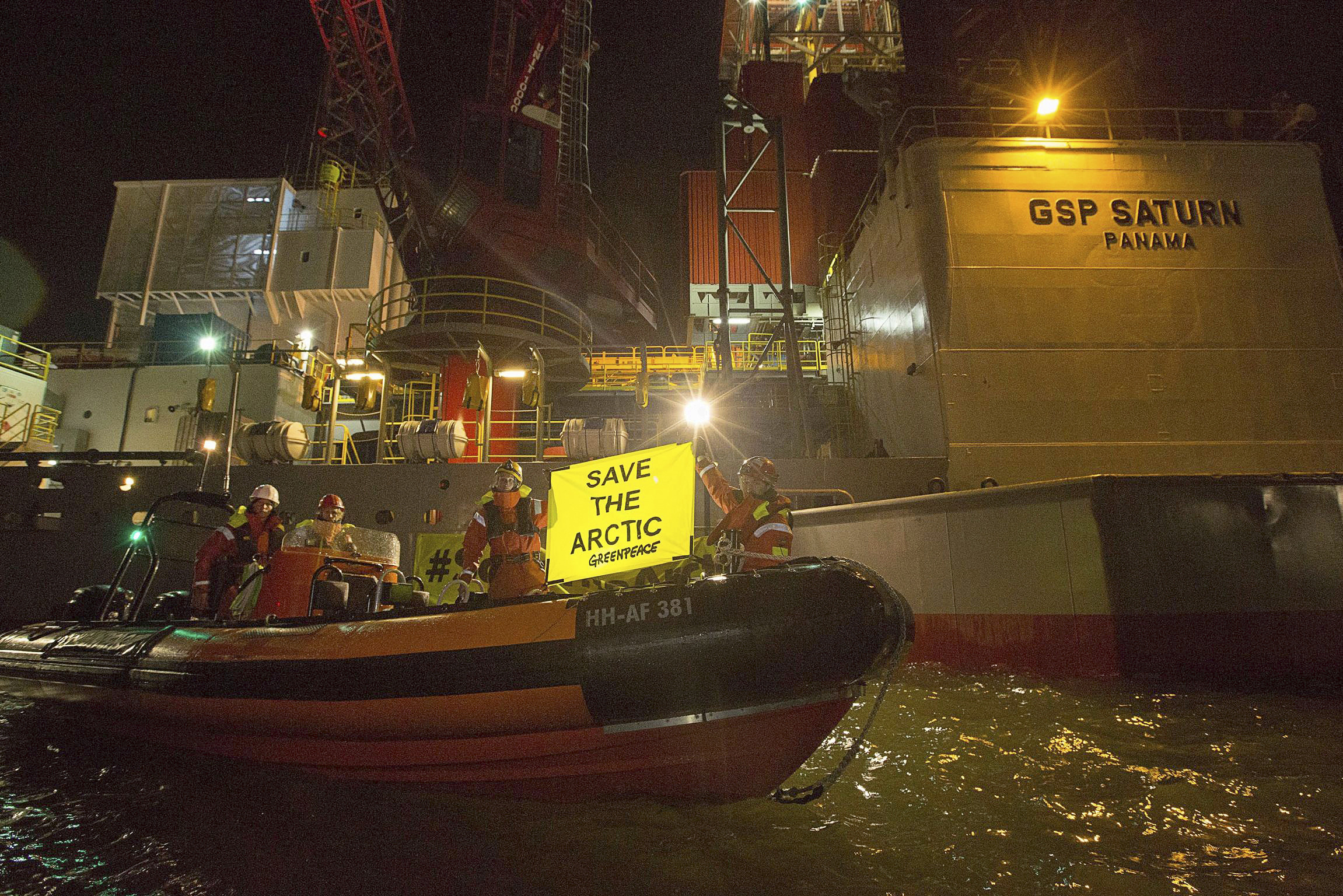 Greenpeace boards 2 drill rigs in Arctic protest