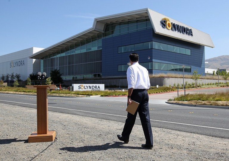 FREMONT, CA - MAY 31:  Repubican presidential candidate and former Massachusetts Gov. Mitt Romney walks to the podium to speak during news conference in front the shuttered Solyndra solar power company's manufacturing facility May 31, 2012 in Fremont, California.  The company filed for bankruptcy in 2011 after receiving $535 million in federal loan money.  (Photo by Justin Sullivan/Getty Images)