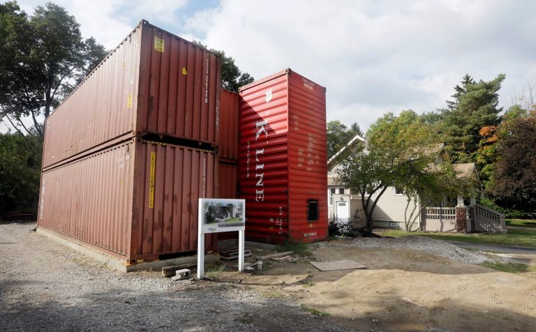 A home built of commercial shipping containers is under construction in Royal Oak, Mich., Wednesday, Oct. 1, 2014. Seven shipping containers will be transformed to make up the 2,100 square-foot home, which includes three bedrooms and 2.5 bathrooms. Holes for windows and passageways will be cut before plumbing, electrical wiring and other mechanical functions are installed. (AP Photo/Carlos Osorio)