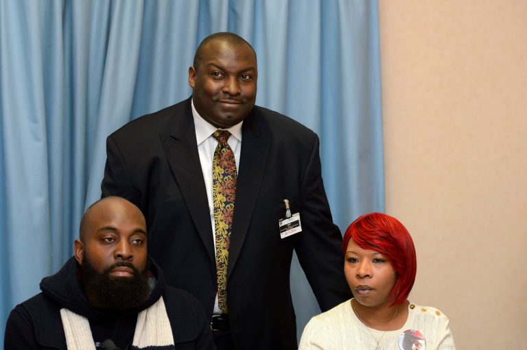Lesley McSpadden and Michael Brown, Sr., left, parents of teenager Michael Brown who was shot by a policeman in Ferguson, Mo., and attorney Daryl Parks, center, speak during a press conference, Wednesday, Nov. 12, 2014. (AP Photo/Keystone, Martial Trezzini)